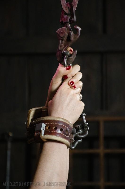 16P Siouxsie Q bound in metal on red high heels with ballgag and nipple clamps