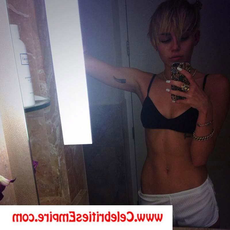 20P Miley Cyrus poses topless and nude in fishnet pantyhose