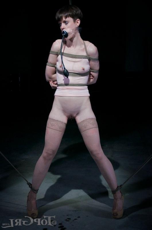 16P Hazel Hypnotic is rope bound wearing high heels in dark dungeon