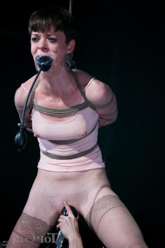 16P Hazel Hypnotic is rope bound wearing high heels in dark dungeon