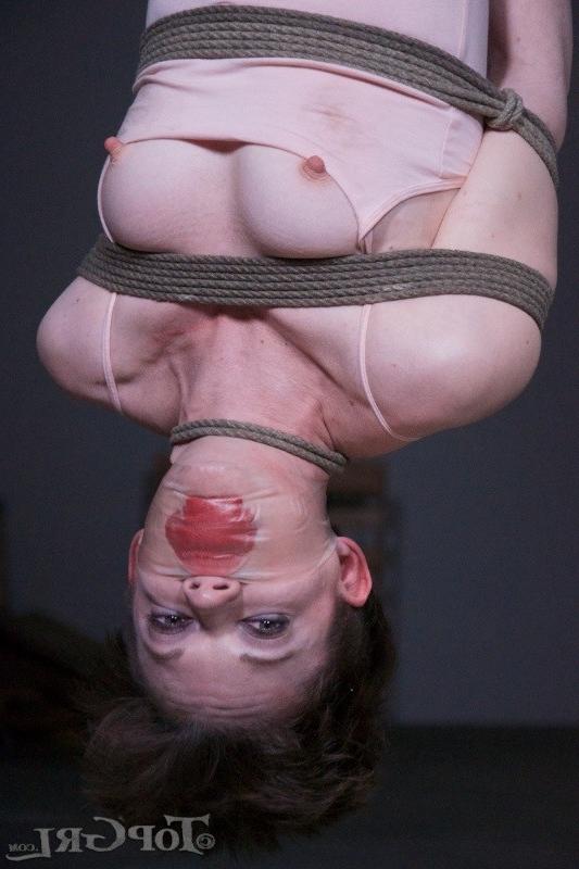 16P Hazel Hypnotic is rope bound wearing high heels in dark dungeon