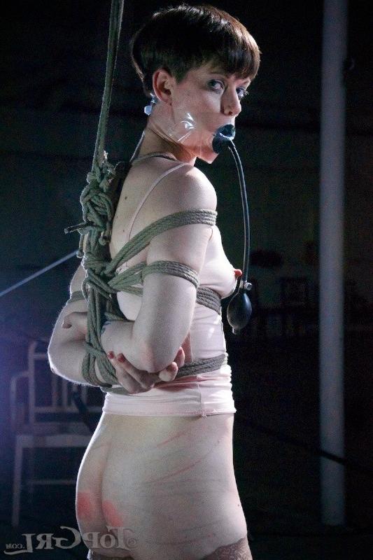 16P Hazel Hypnotic is rope bound wearing high heels in dark dungeon