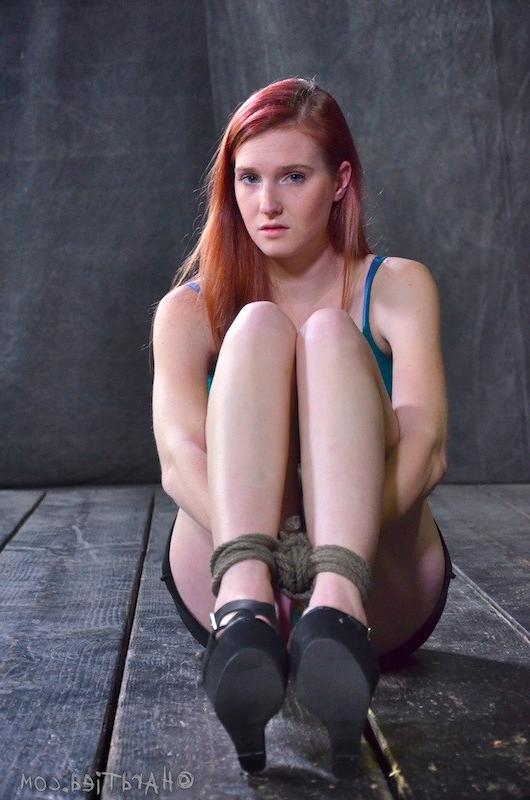 16P Ashley Lane redhead rope bound with tits exposed and ass toyed