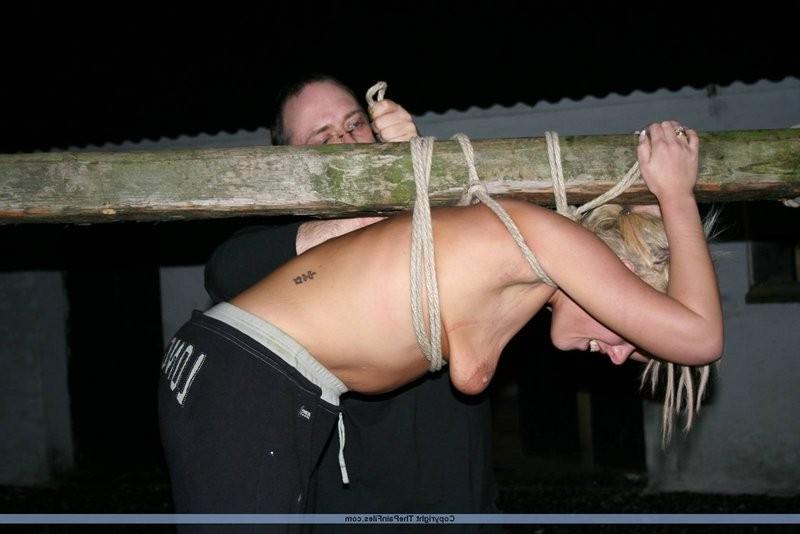 12P Blonde slave gets tied up to a stick