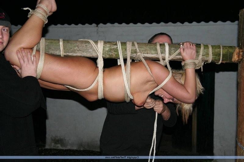 12P Blonde slave gets tied up to a stick