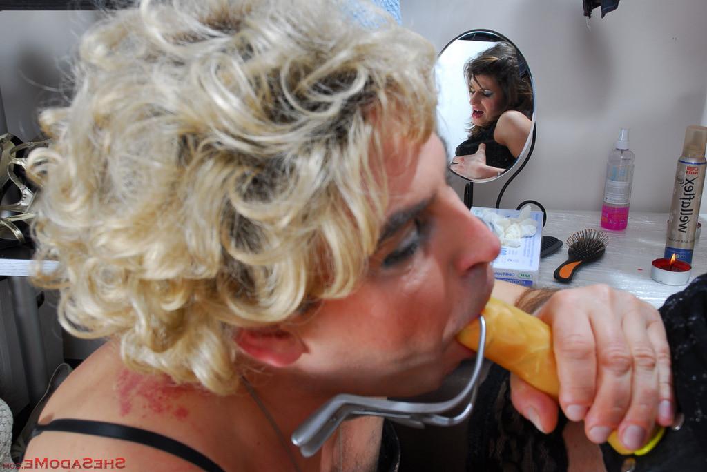 20P Stripped naked sissy in a blond wig gets his ass poked and probed by a lady