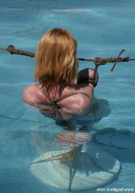 15P Slave girl tied up and pushed in the water