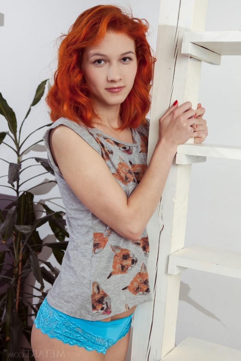 12P Slim natural redhead in panties