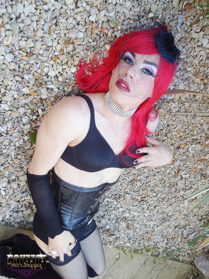 15P Gorgeous red head Zoe plays with her huge cock