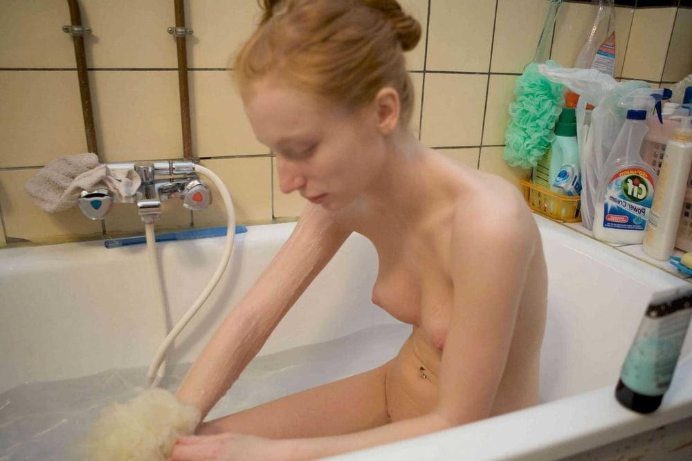 25P Hot slim redhead webslut loves exposing herself