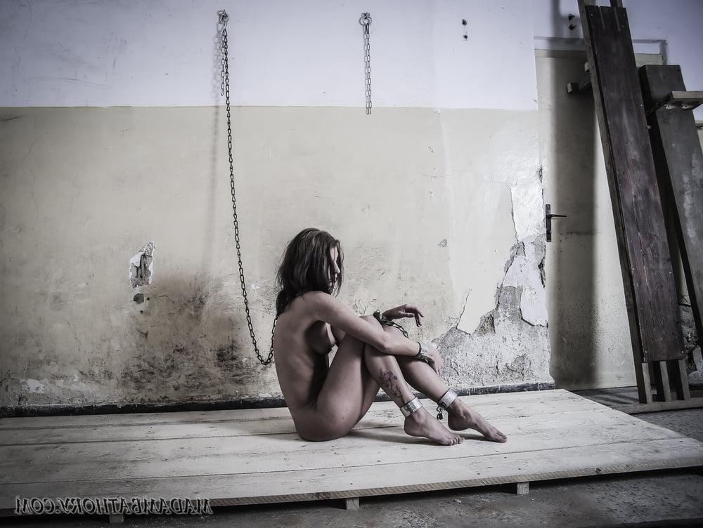 25P Shackled white slave