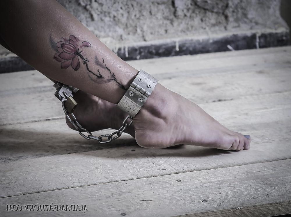 25P Shackled white slave